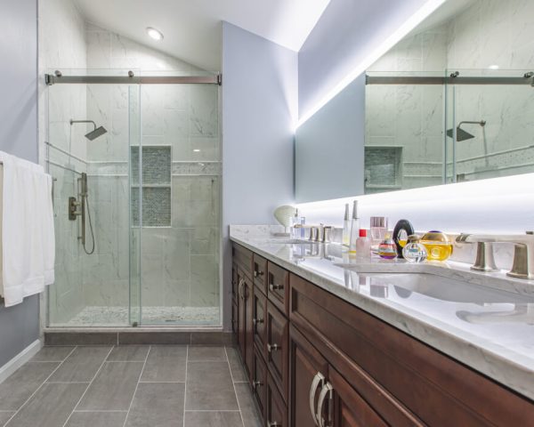 Vanity, tile and lighting in BST Design & Build’s Elkridge bathroom remodel